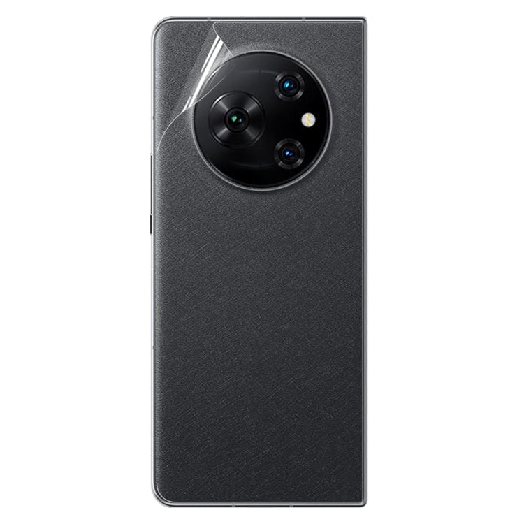 Hydrogel back screen protector applied on dark phone back with triple camera module