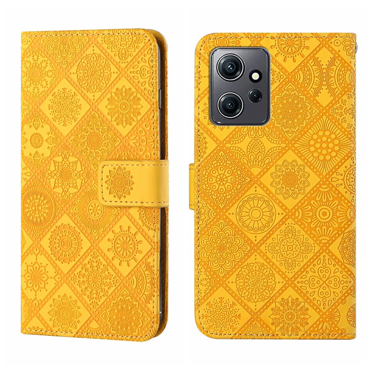 Yellow embossed pattern leather wallet-style phone case with magnetic strap and camera cutout