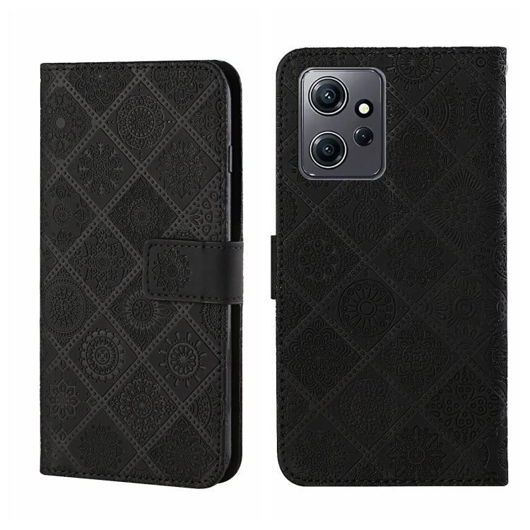 Black embossed pattern leather wallet-style phone case with magnetic strap and camera cutout