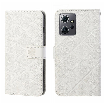 White embossed pattern leather wallet-style phone case with magnetic strap and camera cutout