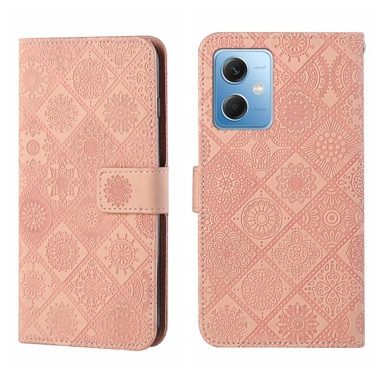 Pink embossed pattern leather wallet-style phone case with magnetic strap and rear camera opening