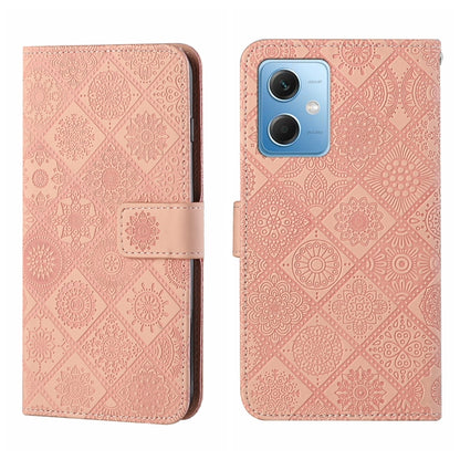 Pink embossed pattern leather wallet-style phone case with magnetic strap and rear camera opening