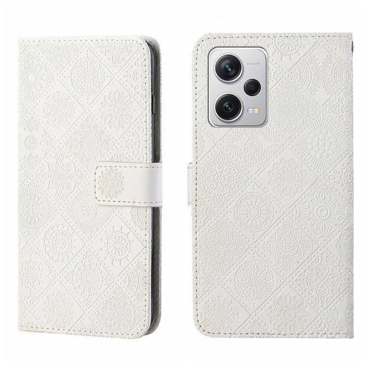 White embossed leather-style phone case with flip cover and camera cutout