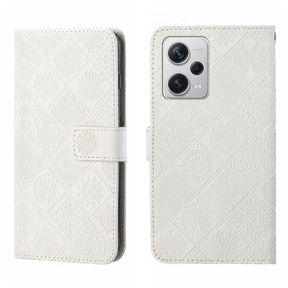 White embossed leather-style phone case with flip cover and camera cutout