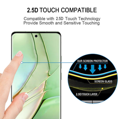 Curved tempered glass screen protector aligned by a hand on a smartphone display.