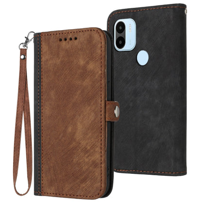 Leather phone case with wrist strap, double-fold design; brown front and black back, camera cutout.