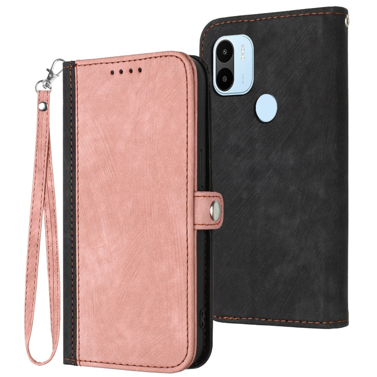 Pink leather folio phone case with side buckle and wrist strap, double-fold cover.