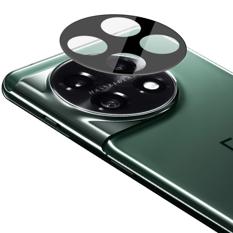 Integrated glass lens film over dual camera lenses on a green smartphone