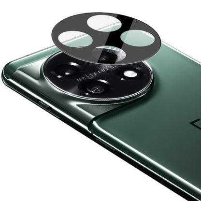 Integrated glass lens film over dual camera lenses on a green smartphone