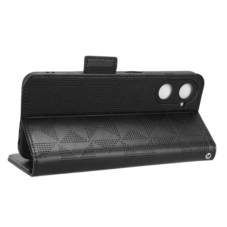 Black leather folio phone case with symmetric triangle texture and magnetic snap closure