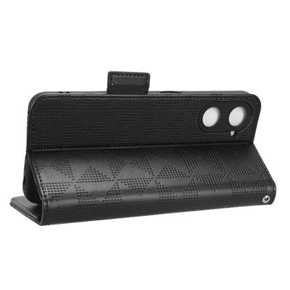 Black leather folio phone case with symmetric triangle texture and magnetic snap closure