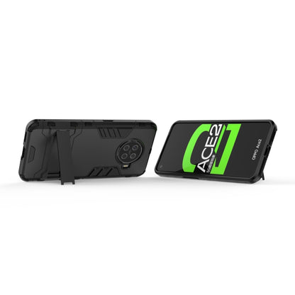 Rugged shockproof phone case with holder, black back and angled front view