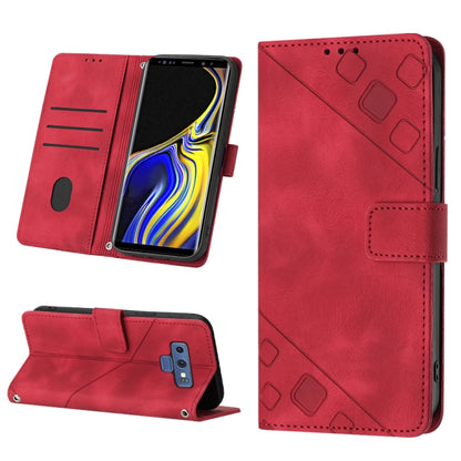 Red embossed leather phone folio case with wallet flap, card slots, and kickstand design.