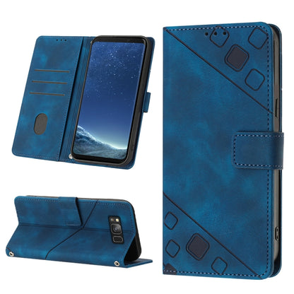 Blue embossed leather folio phone case with geometric embossed front and wallet-style flap.