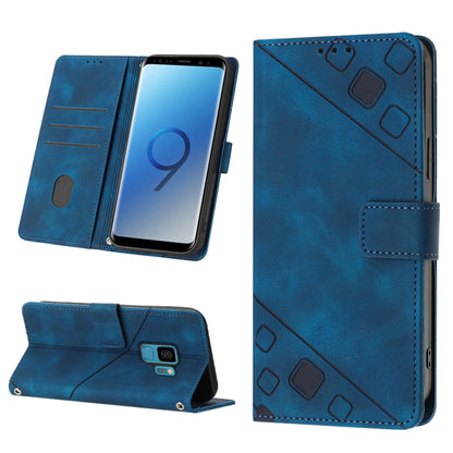 Blue embossed leather folio phone case with side cutouts, card slots, and magnetic strap.