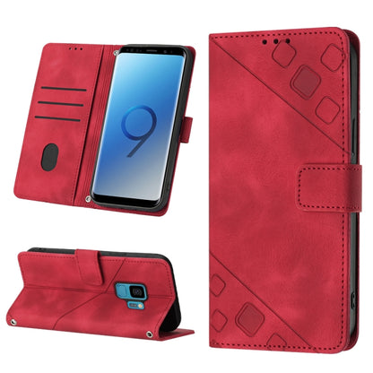 Red embossed leather wallet phone case with flip cover, card slots, and magnetic strap