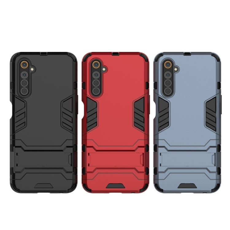 Rugged shockproof phone case in black, red, and light blue with camera cutouts