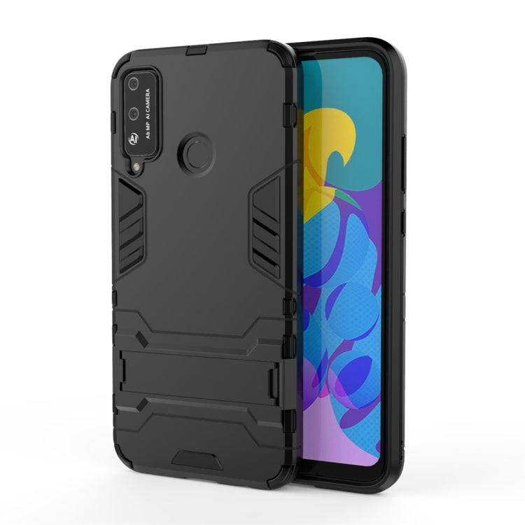 Black rugged phone case with built-in circular holder on the back