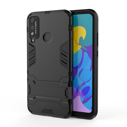 Black rugged phone case with built-in circular holder on the back