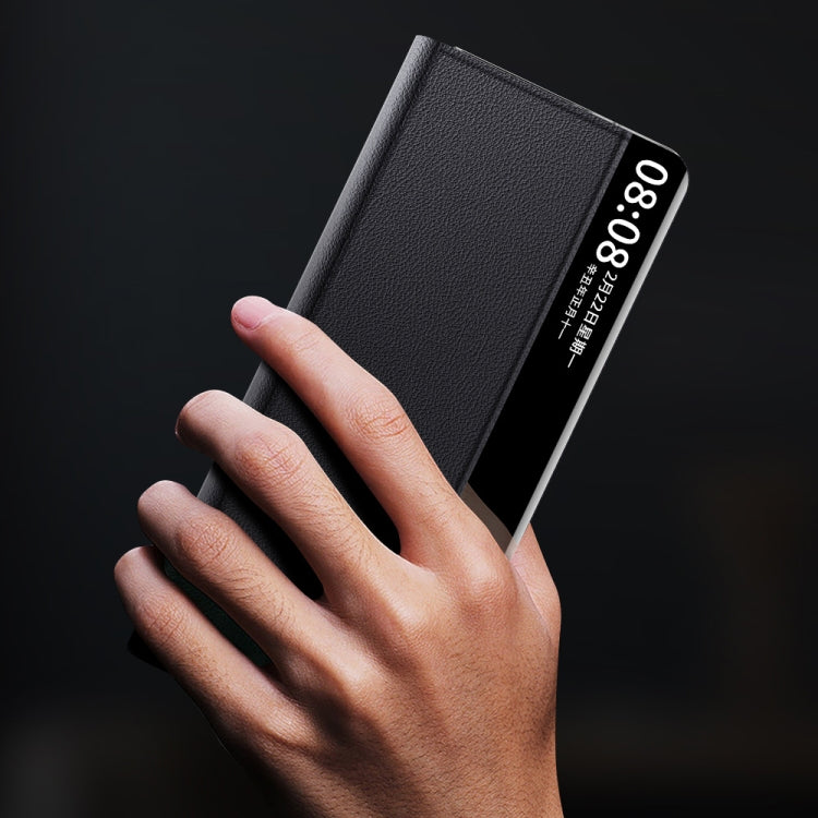 Black magnetic flip phone case held in hand with embossed texture