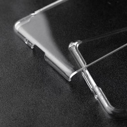 Transparent PC phone case corner with raised lip and side button openings