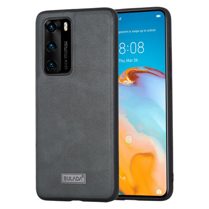 Black handmade leather protective phone case with camera cutouts and SULADA badge.
