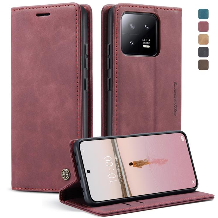 Wine red leather flip phone case with stitched edges and camera cutout, phone in landscape stand.