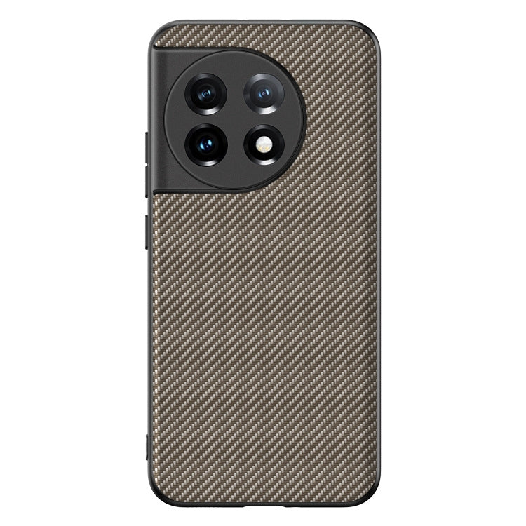 Phone case with carbon fiber texture print and raised camera cutouts, tan with black frame.