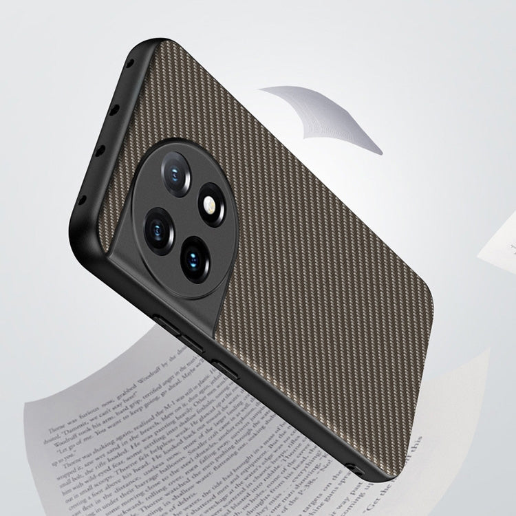 Slim phone case with carbon fiber texture print, raised camera cutouts, tan with black edges.