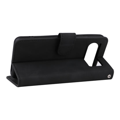 Black magnetic flip leather phone case used as a tabletop stand with viewing angle.