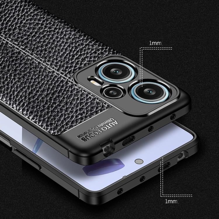 Black TPU phone case with litchi texture, reinforced corners, raised screen edges