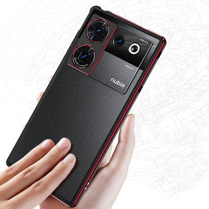 Black metal frame phone case with lens cover and red trim, held in hand