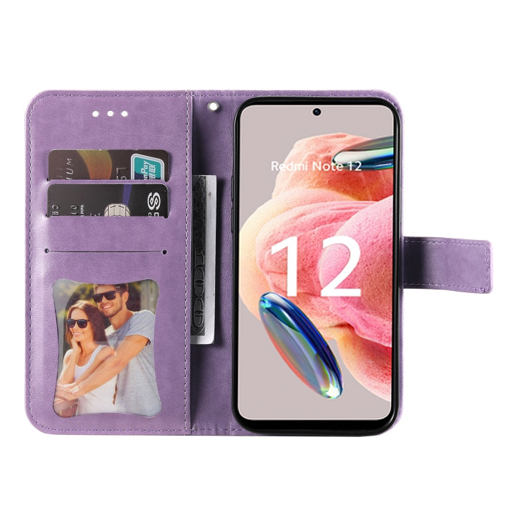 Purple leather wallet phone case with embossed floral design and inner card pockets