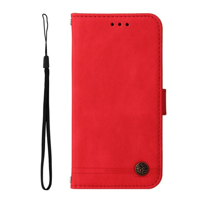 Red leather folio phone case with wrist strap and metal button closure