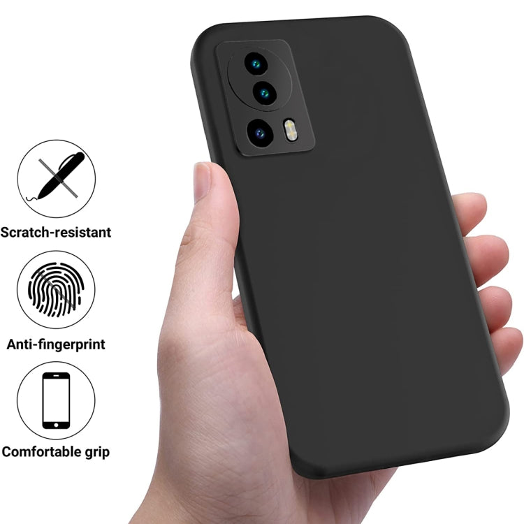 Black silicone phone case with raised edges and camera cutouts, shown being held.