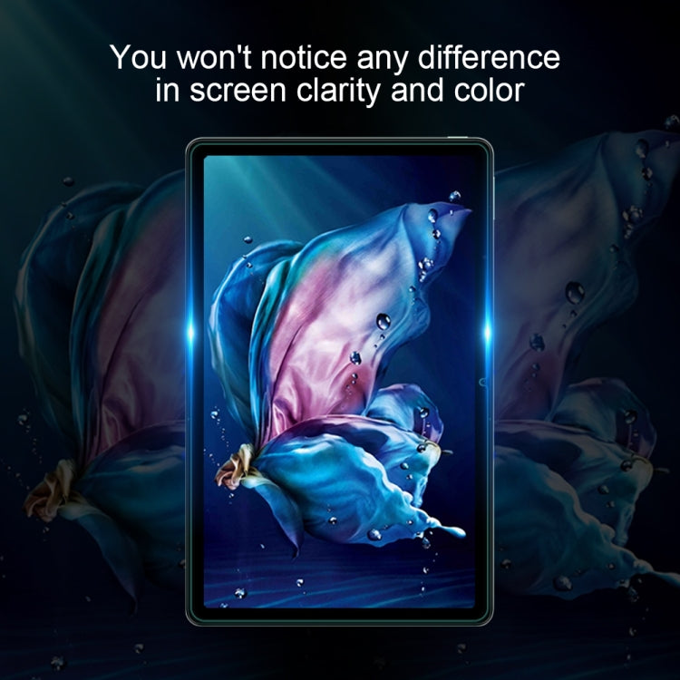 Tempered glass screen protector film on tablet showing blue splash graphics
