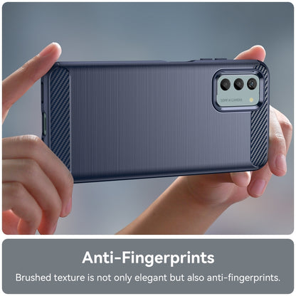 Blue brushed texture TPU phone case held in hands, slim profile with camera protection