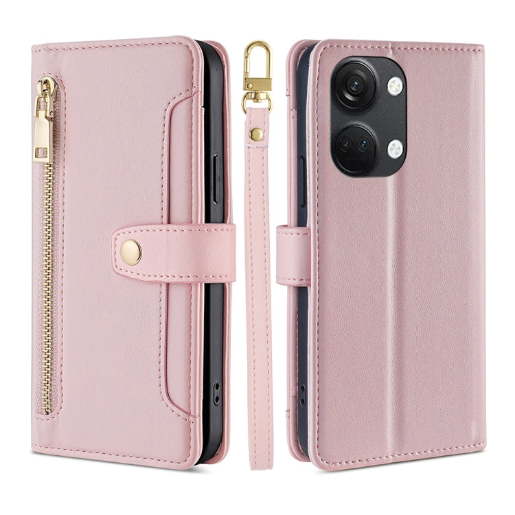 Pink leather cross-body wallet phone case with zipper and snap strap