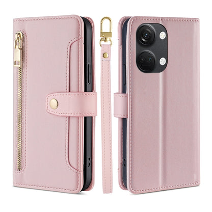 Pink leather cross-body wallet phone case with zipper and snap strap