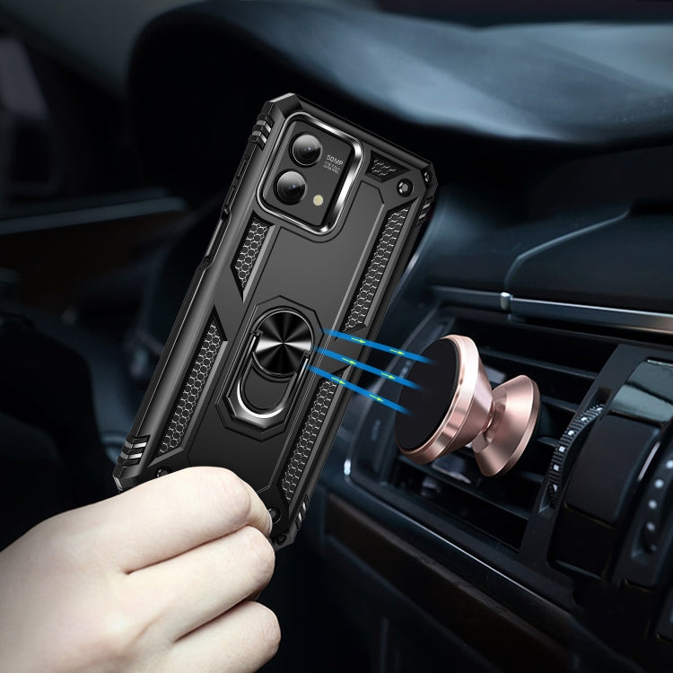 Black rugged phone case with metal ring holder attached to a car air vent
