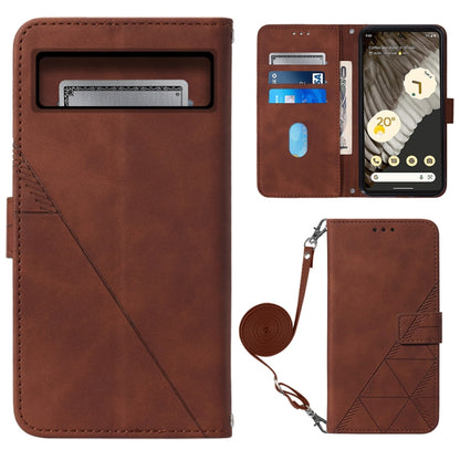 Crossbody flip leather phone case in brown with embossed diamond pattern and wrist strap