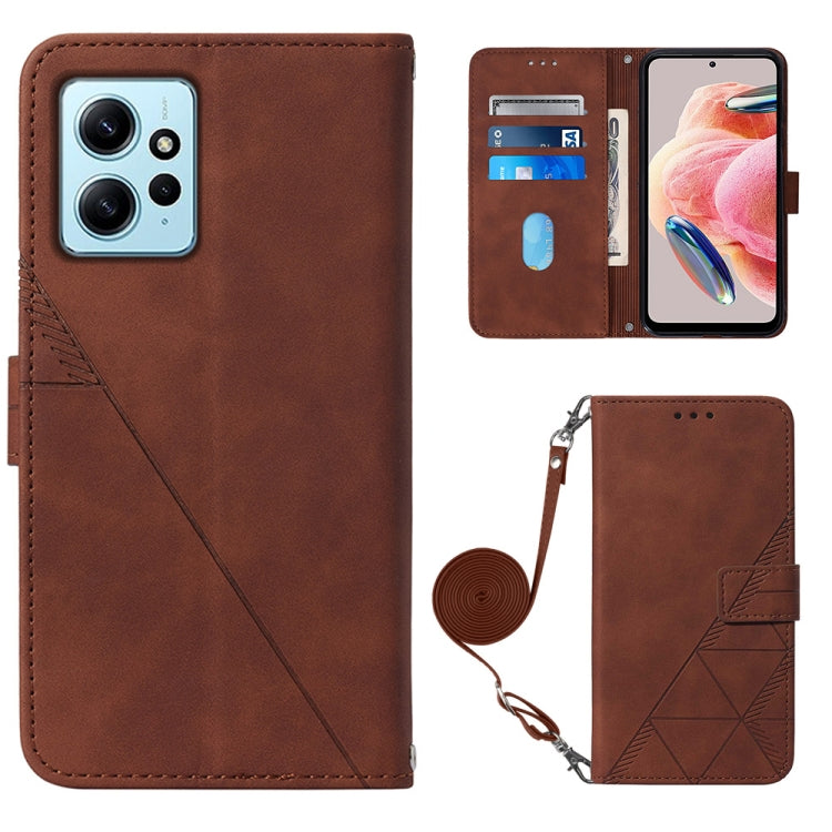 Brown leather flip phone case with geometric embossed side and crossbody strap.