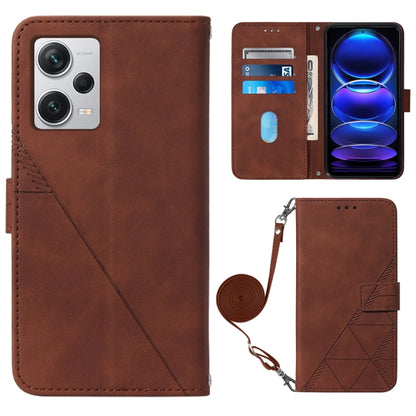 Brown 3D embossed leather flip phone case with crossbody wrist strap and magnetic closure