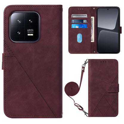 Wine red 3D embossed leather flip phone case with crossbody wrist strap and magnetic closure