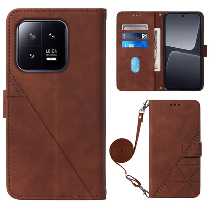Brown leather crossbody flip phone case with 3D embossed pattern and wrist strap
