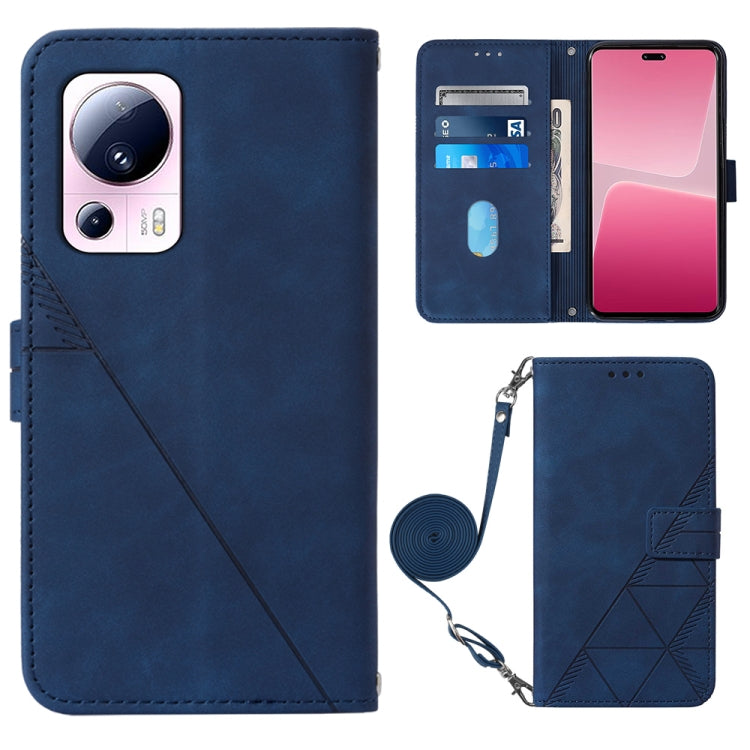 Blue leather crossbody flip phone case with 3D embossed pattern and wrist strap