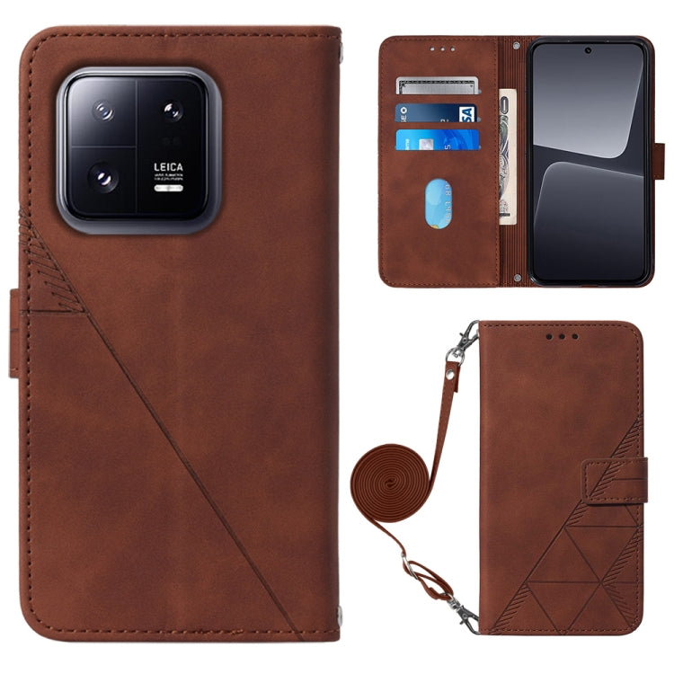 Brown crossbody flip leather phone case with diagonal seam, magnetic clasp, and strap holder