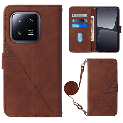 Brown crossbody flip leather phone case with diagonal seam, magnetic clasp, and strap holder