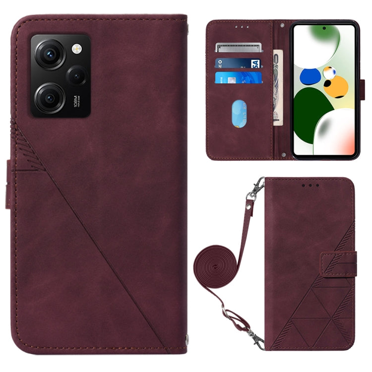 Wine red crossbody flip leather phone case with diagonal seam, magnetic clasp, and strap holder