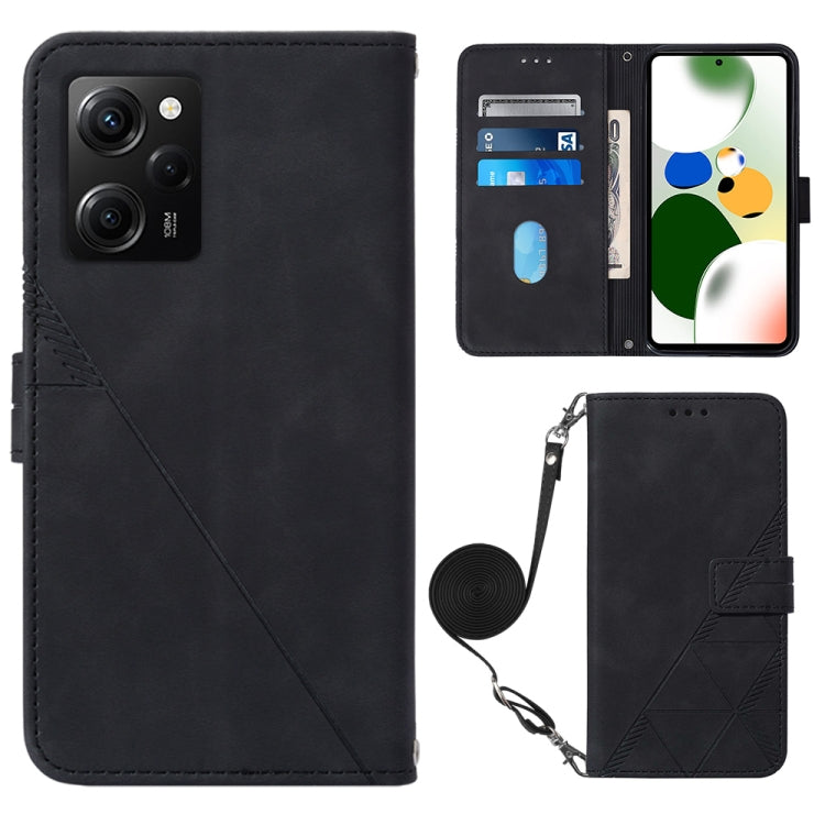 Black crossbody flip leather phone case with diagonal seam, magnetic clasp, and wrist strap